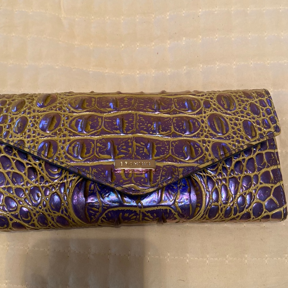 Nearly brand new Brahmin wallet in purple and neon green over crocodile print.